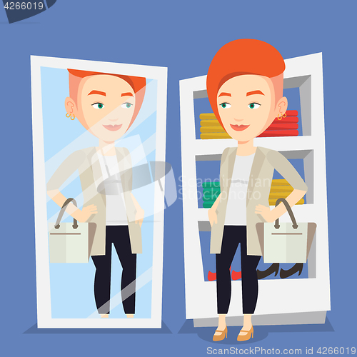 Image of Woman trying on clothes in dressing room.