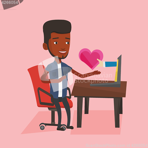 Image of Young man dating online using laptop.