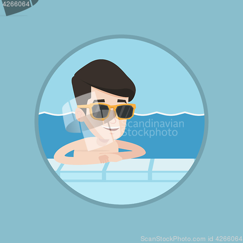 Image of Smiling young man in swimming pool.