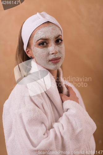 Image of Spa Woman applying Facial Mask