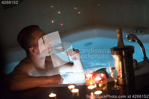 Image of man relaxing in the jacuzzi