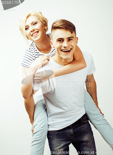 Image of young pretty teenage couple, hipster guy with his girlfriend happy smiling and hugging isolated on white background, lifestyle people concept