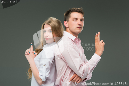 Image of The young couple with different emotions during conflict