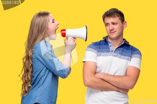 Image of Woman shouting in megaphones at each other