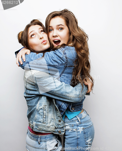 Image of best friends teenage girls together having fun, posing emotional on white background, besties happy smiling, lifestyle people concept close up. making selfie