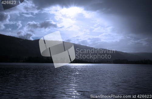 Image of Lake amongst the woods, cloudy summer sky, Sweden