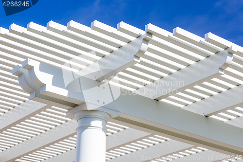 Image of Beautiful House Patio Cover Against the Blue Sky.