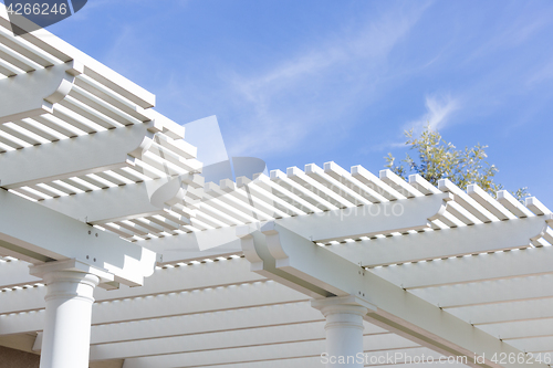 Image of Beautiful House Patio Cover Against the Blue Sky.