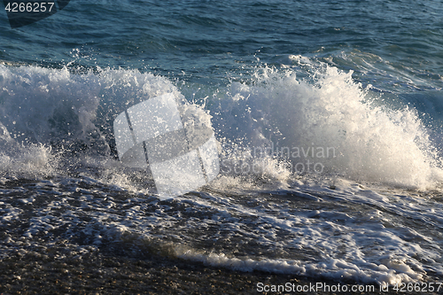 Image of Waves and sea foam on the coast