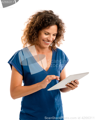 Image of Happy woman working with a tablet