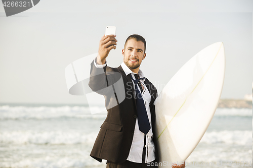 Image of Businessman makifn a selfie