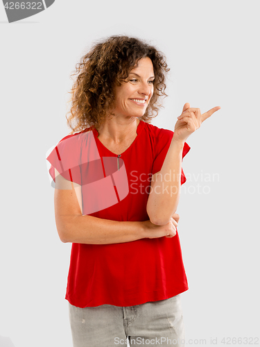 Image of Happy woman pointing