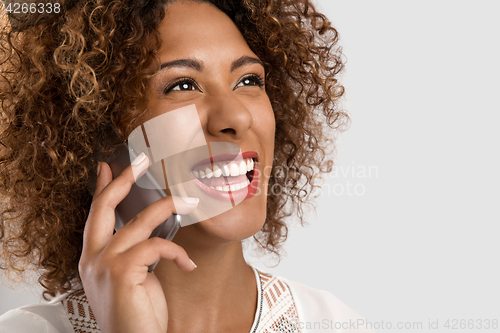 Image of Woman talking on the phone