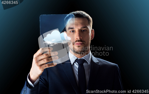 Image of businessman working with transparent tablet pc