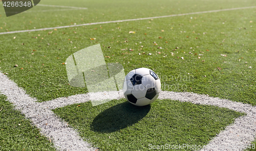 Image of soccer ball on football field