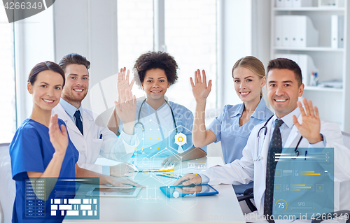 Image of group of happy doctors meeting at hospital office