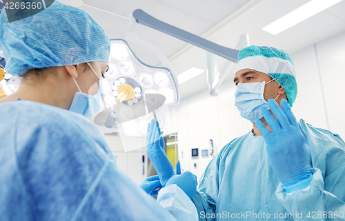 Image of surgeons in operating room at hospital