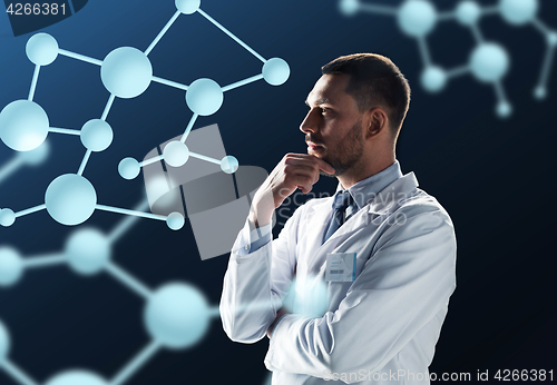 Image of doctor or scientist in white coat with molecules