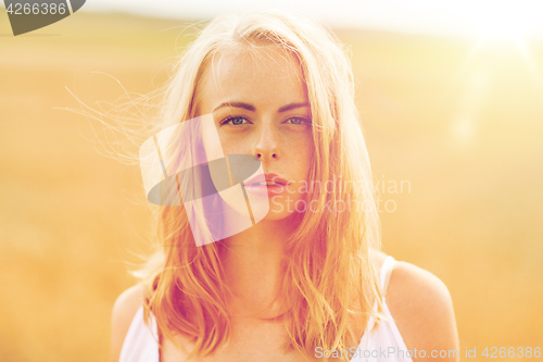Image of young woman in white on cereal field