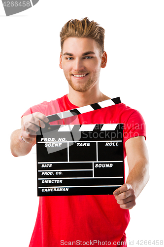 Image of Young man holding a clapboard