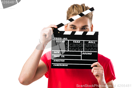 Image of Young man holding a clapboard