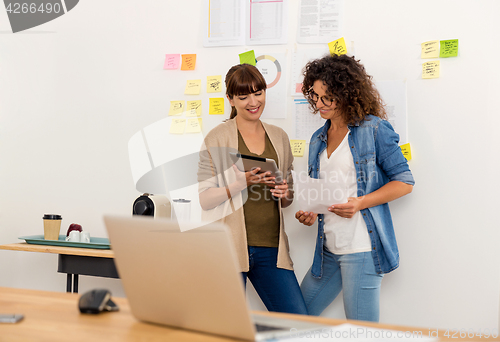 Image of Two businesswoman working together