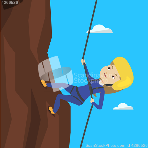 Image of Woman climbing in mountains with rope.