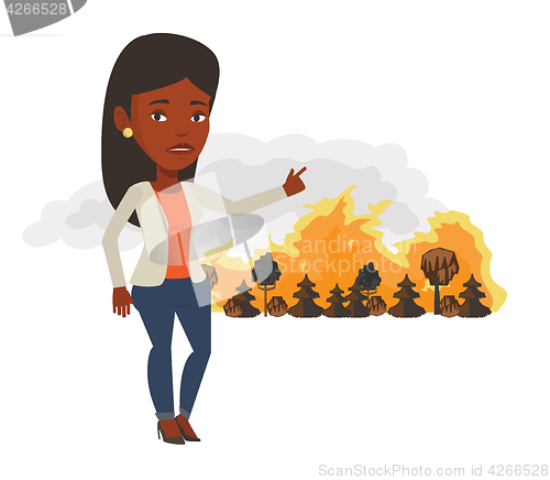 Image of Woman standing on background of wildfire.