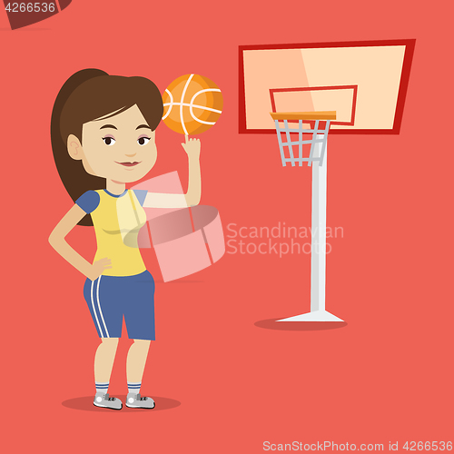 Image of Young basketball player spinning ball.