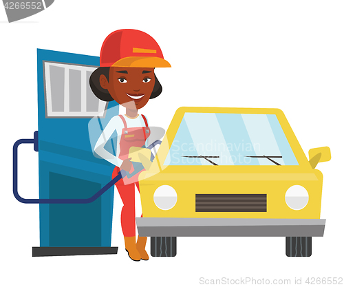 Image of Worker filling up fuel into car.