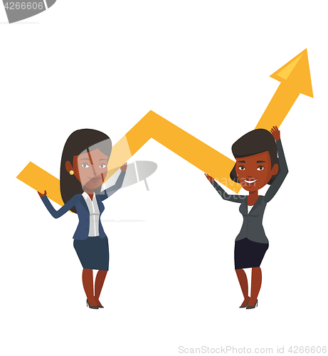 Image of Two businesswomen holding growth graph.