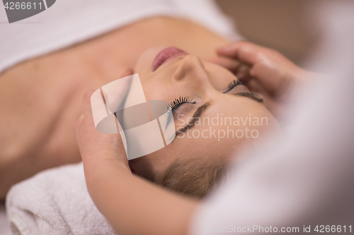 Image of woman receiving a head massage