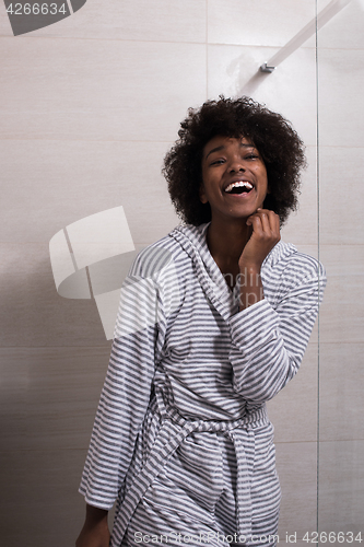 Image of beautiful black woman wearing  bathrobe