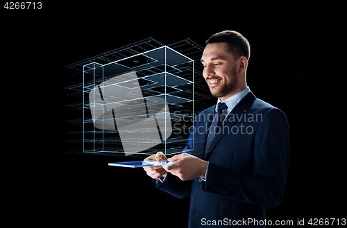 Image of businessman with tablet pc and virtual building