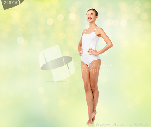 Image of beautiful woman in white underwear over green