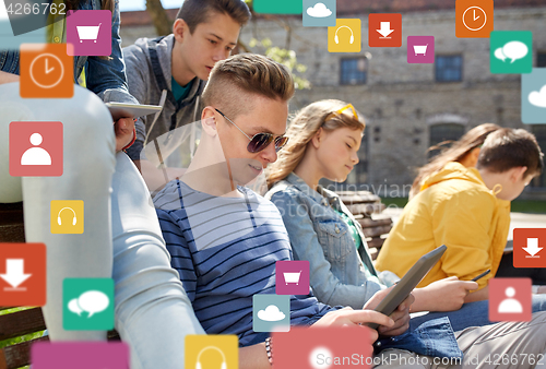 Image of group of students with tablet pc outdoors