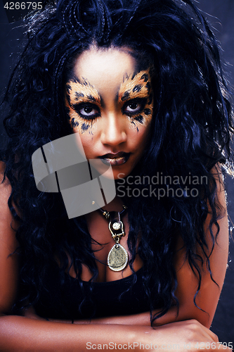 Image of beauty afro girl with cat make up, creative leopard print