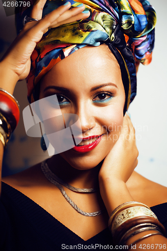 Image of beauty bright african woman with creative make up, shawl on head like cubian