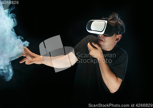 Image of The man with glasses of virtual reality. Future technology concept.