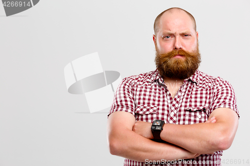 Image of Man with screwed-up eye , beard