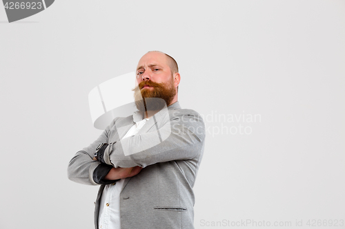 Image of Satisfied man with arms crossed