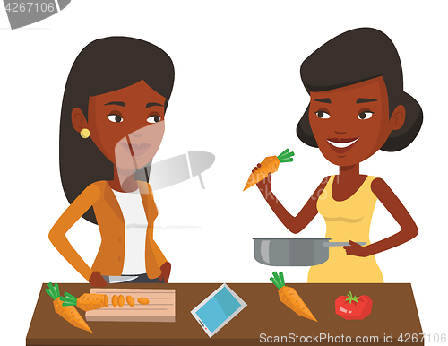 Image of Women cooking healthy vegetable meal.