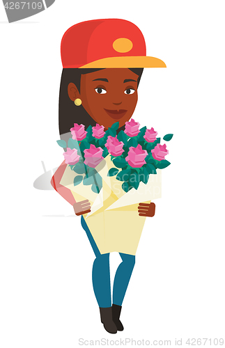 Image of Delivery courier holding bouquet of flowers.
