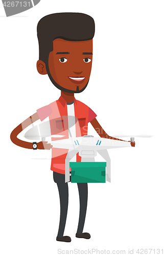Image of Man controlling delivery drone with post package.