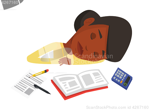 Image of Student sleeping at the desk with book.