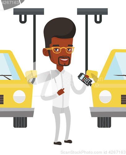 Image of Worker controlling automated assembly line for car