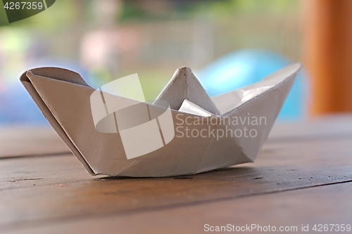 Image of Paper boat on a table