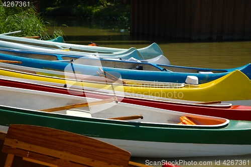 Image of Canoes on the Riverside