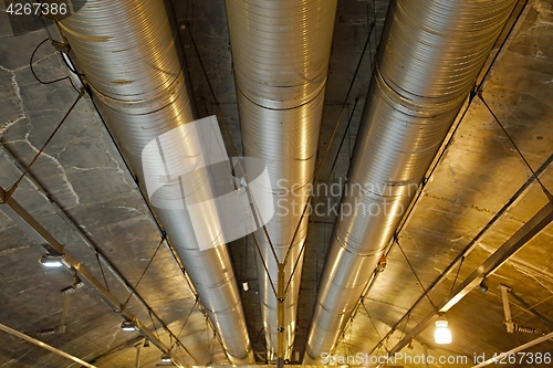 Image of Industrial pipelines in a tunnel