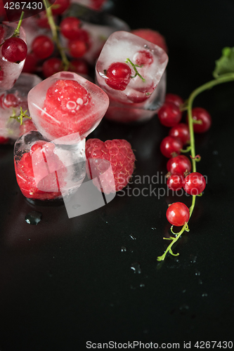 Image of Frozen berries on wooden table